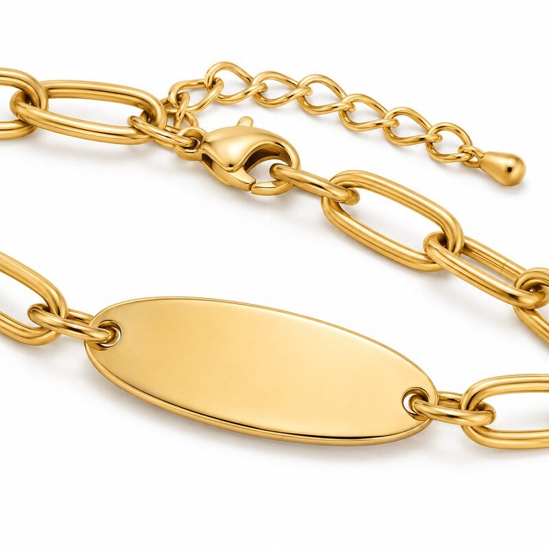Close-up of gold stainless steel bracelet engraving tag lobster clasp and extension chain