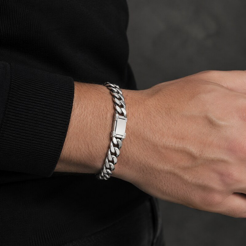Men's polished stainless steel Cuban link bracelet worn on the wrist