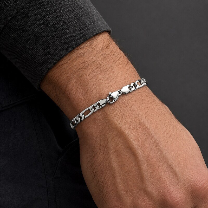 Men's polished stainless steel Figaro chain bracelet worn on the wrist