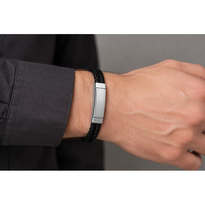 Men's black leather and stainless steel bracelet worn on wrist