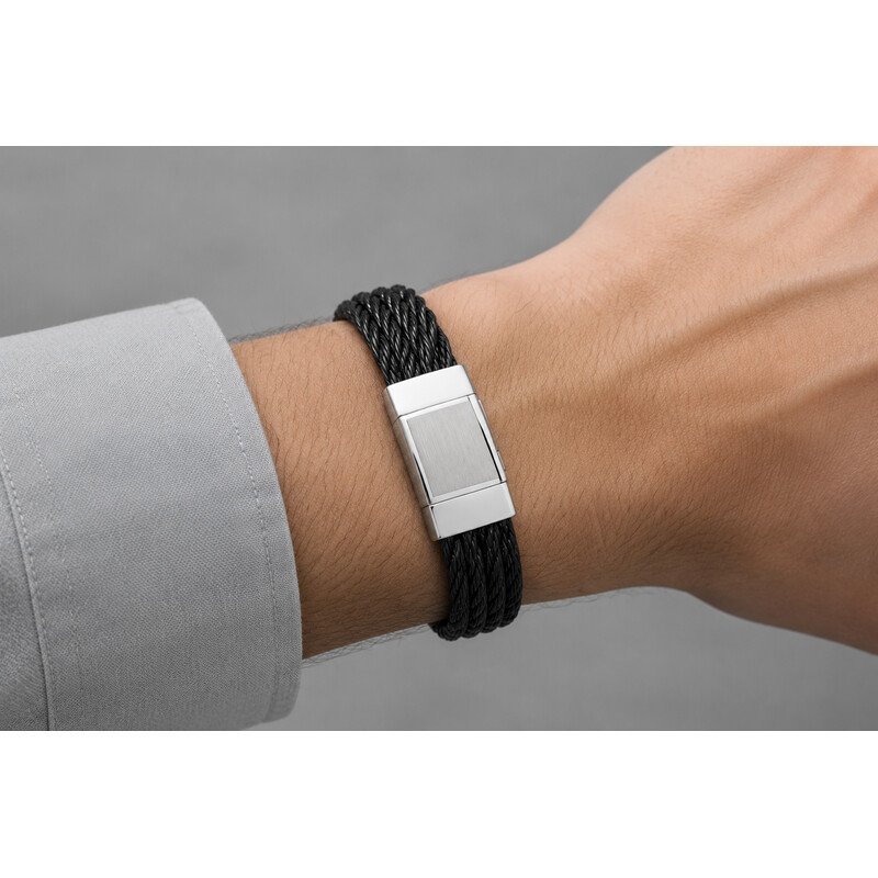 men's black braided steel bracelet on wrist