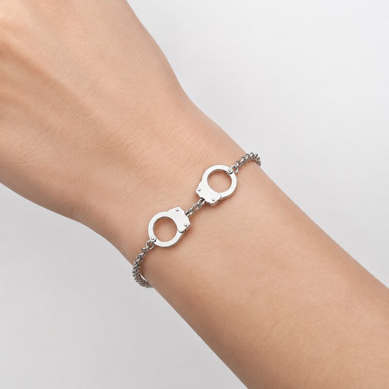 Silver stainless steel handcuff bracelet on wrist