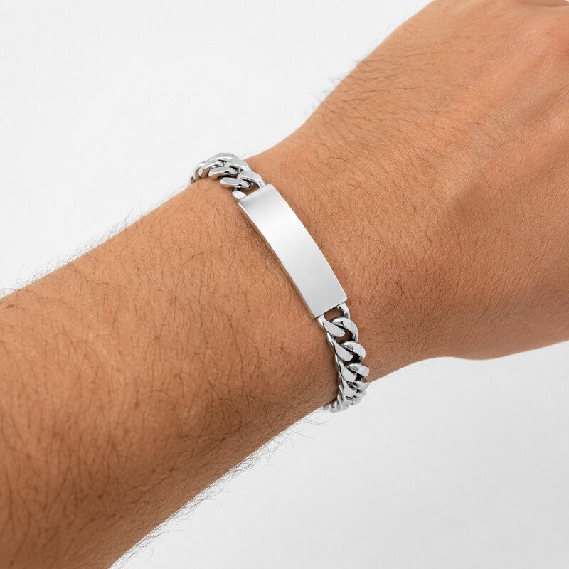 Silver custom ID bracelet worn on wrist