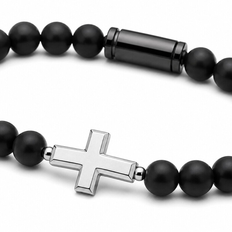 Black stainless steel cross bracelet worn on wrist