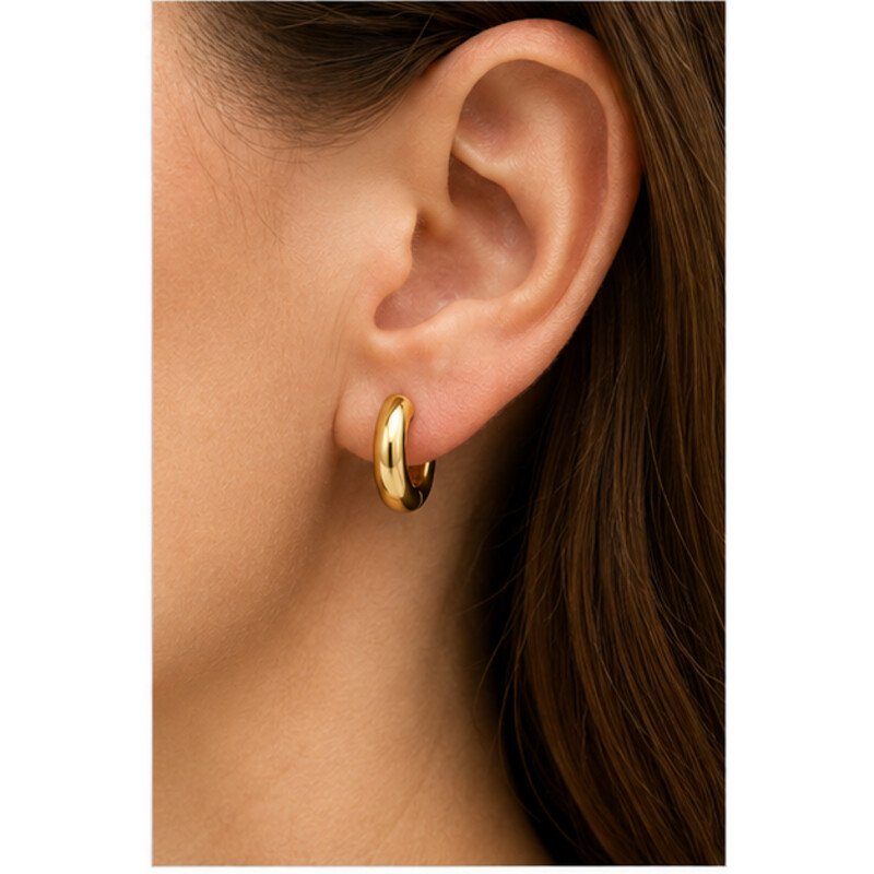 gold stainless steel huggie earrings - model view