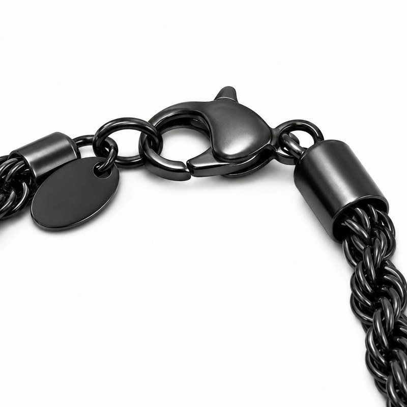 Close-up of the lobster clasp and end tag on a black stainless steel rope chain
