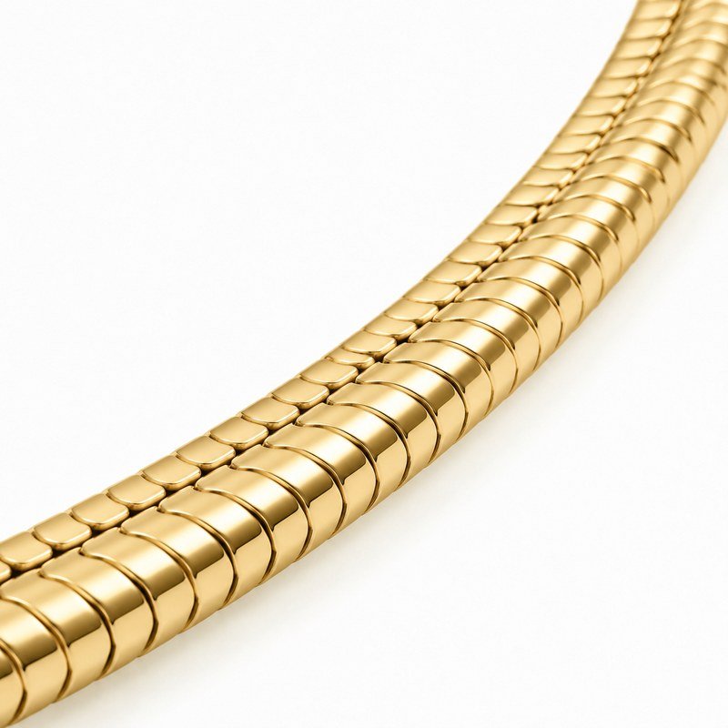 Polished articulated surface detail of a gold PVD stainless steel snake chain