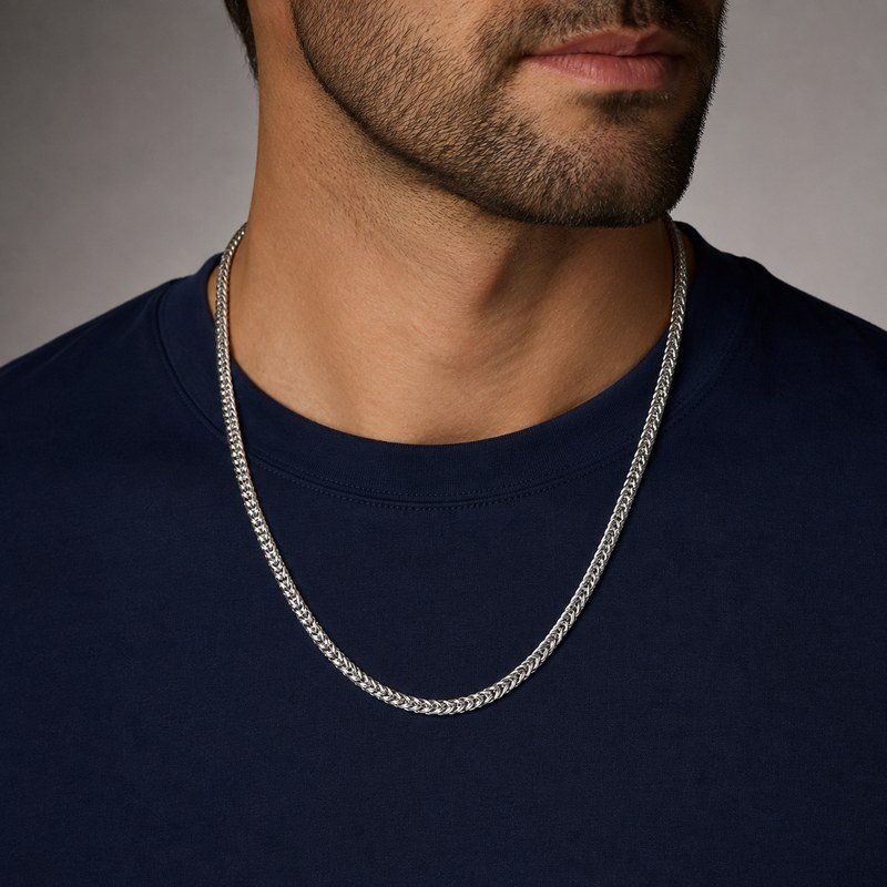 Male model wearing a polished silver stainless steel wheat chain necklace