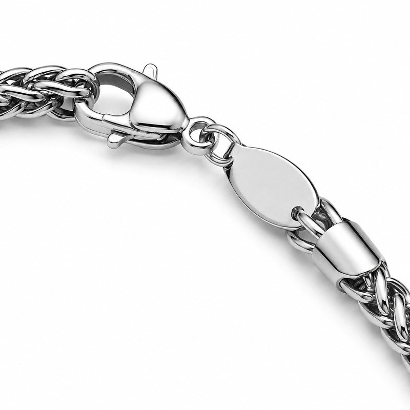 Close-up of the lobster clasp and end tag on a stainless steel wheat chain