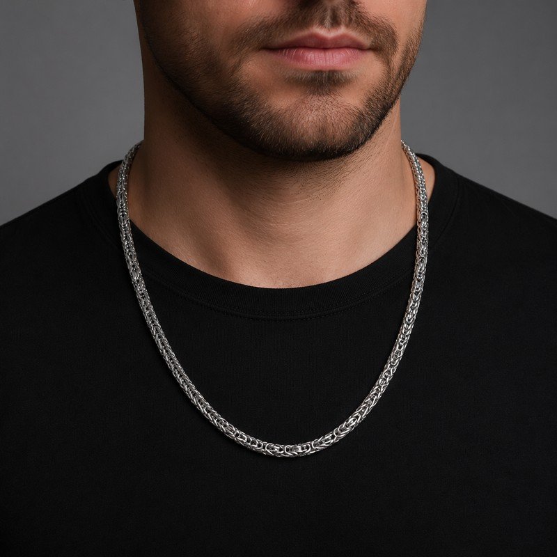 Man wearing a silver stainless steel Byzantine chain necklace, 6 mm wide and 55 cm long