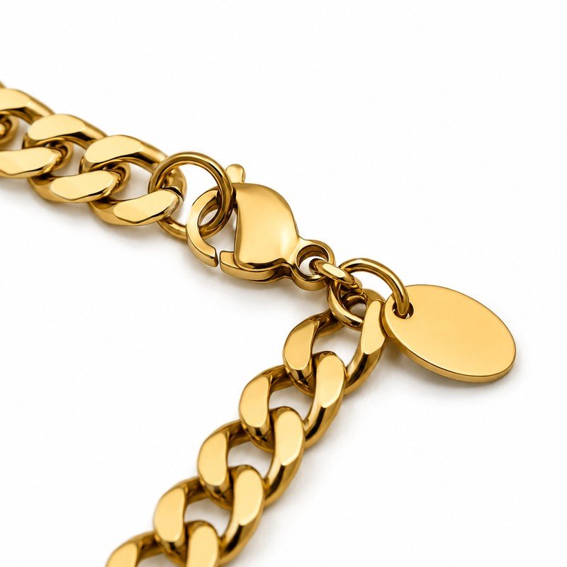 Gold stainless steel curb chain necklace lobster clasp, jump rings and blank oval tag structure detail