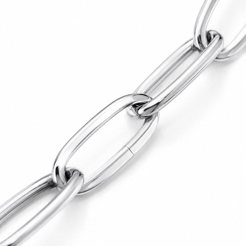 Polished stainless steel paperclip chain link and weld craftsmanship macro detail