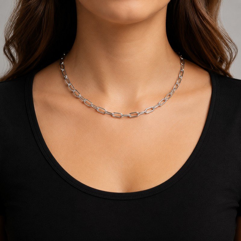 Woman wearing a silver stainless steel paperclip chain necklace with adjustable length