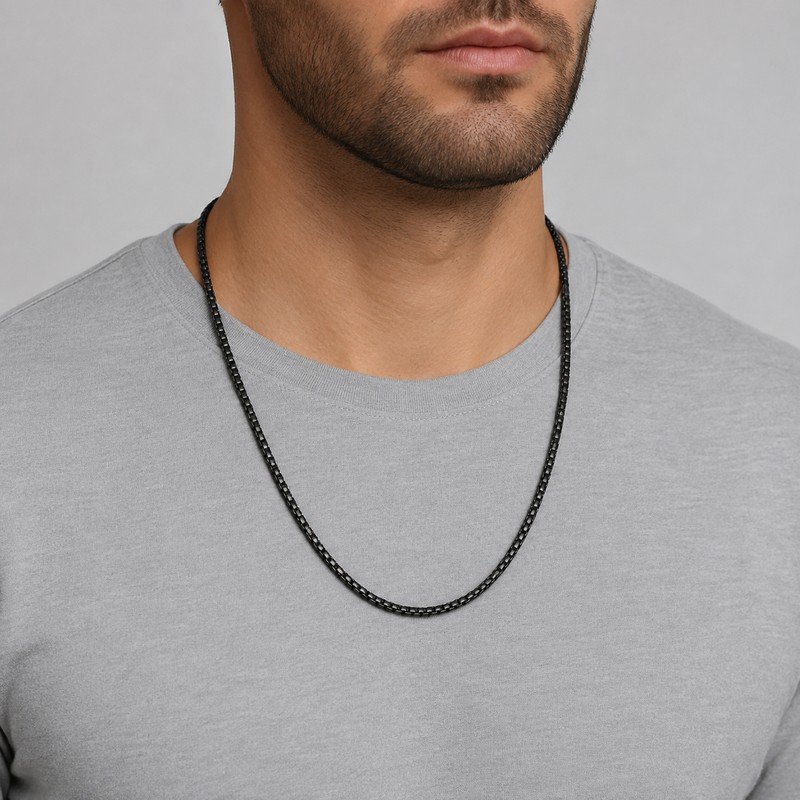 Man wearing a black stainless steel box chain necklace, 4 mm wide and 60 cm long