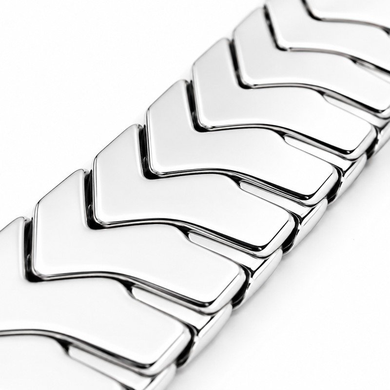 Mirror-polished stainless steel herringbone chevron link craftsmanship macro detail