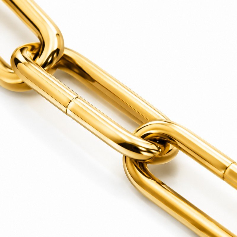 Polished gold PVD stainless steel paperclip link macro detail