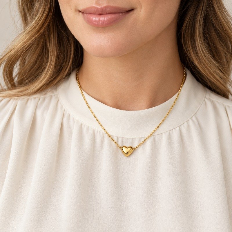 Adult woman wearing a gold Stainless Steel heart pendant necklace