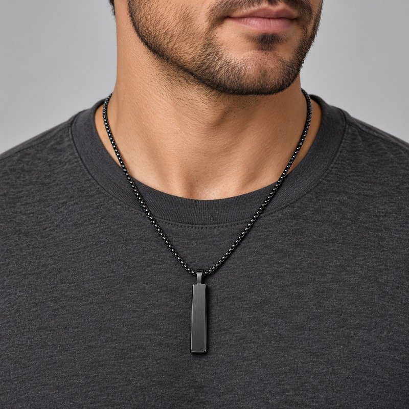 Adult man wearing a black Stainless Steel vertical bar pendant necklace