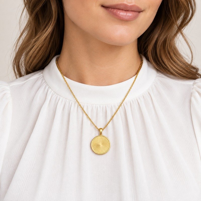 Adult woman wearing a gold Stainless Steel sunburst coin pendant necklace