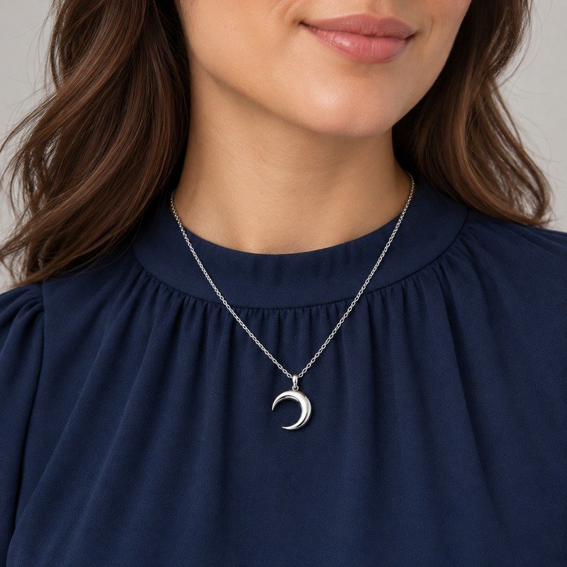 Adult woman wearing a silver Stainless Steel crescent moon pendant necklace