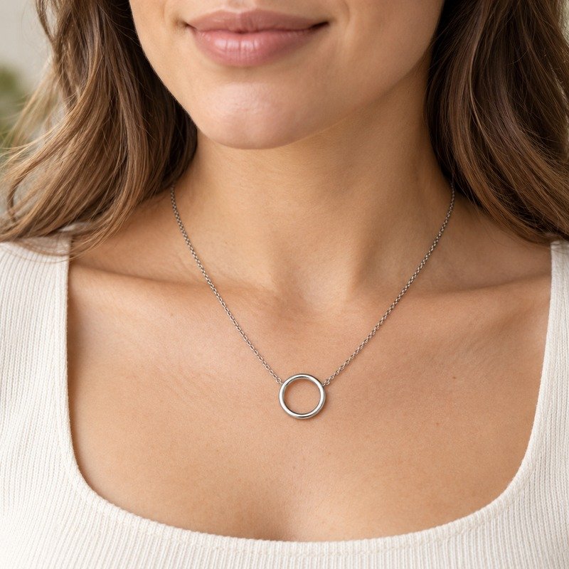 Woman wearing a silver Stainless Steel open circle pendant necklace