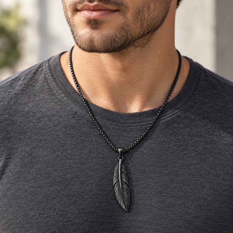 Man wearing a black Stainless Steel feather pendant necklace
