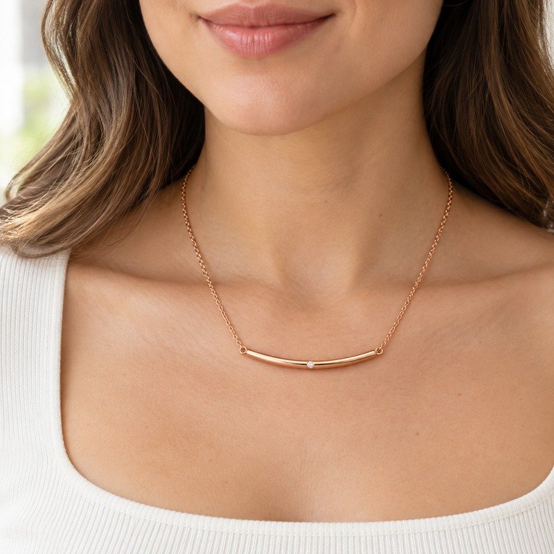 Woman wearing a rose gold Stainless Steel curved bar necklace