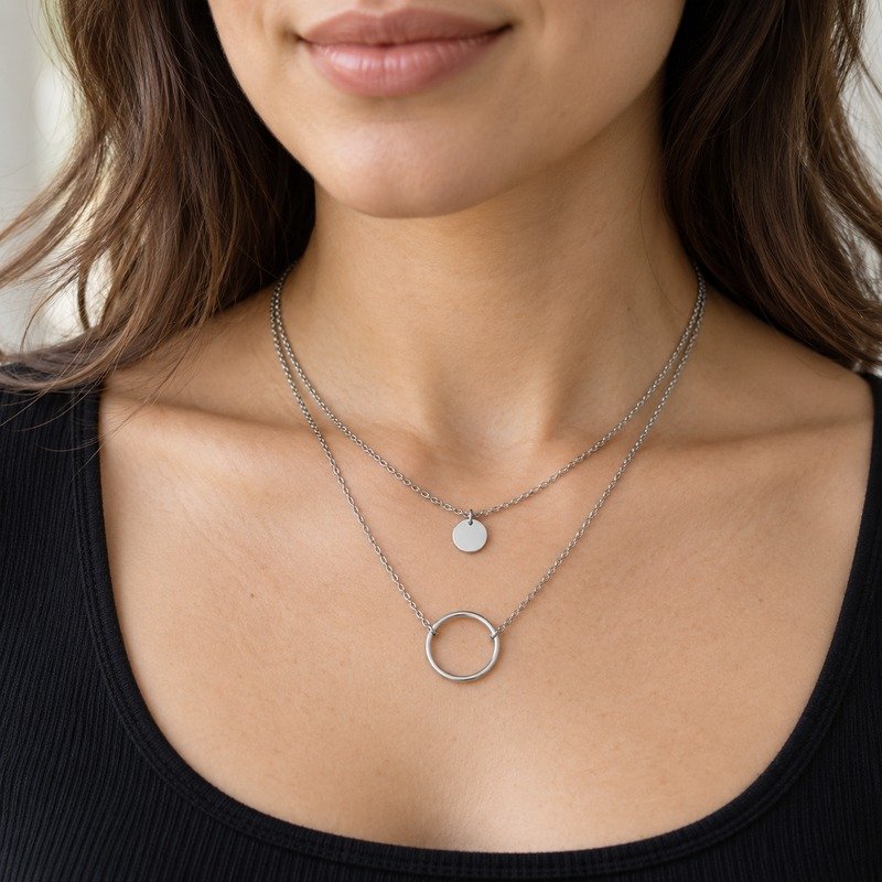 Woman wearing a silver Stainless Steel layered disc and circle necklace