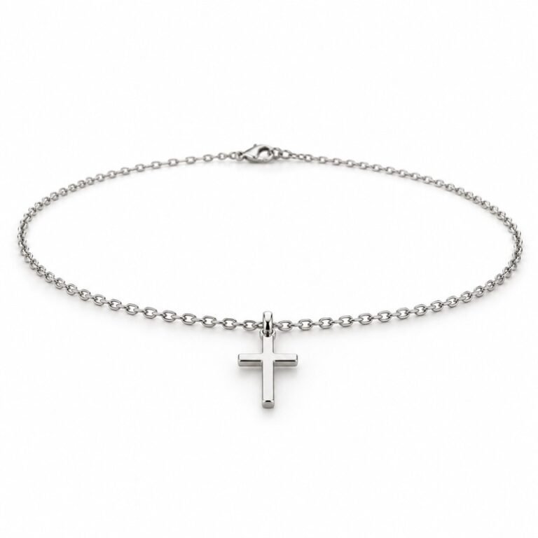 womens silver Stainless Steel petite cross pendant necklace, at a 45-degree angle on white