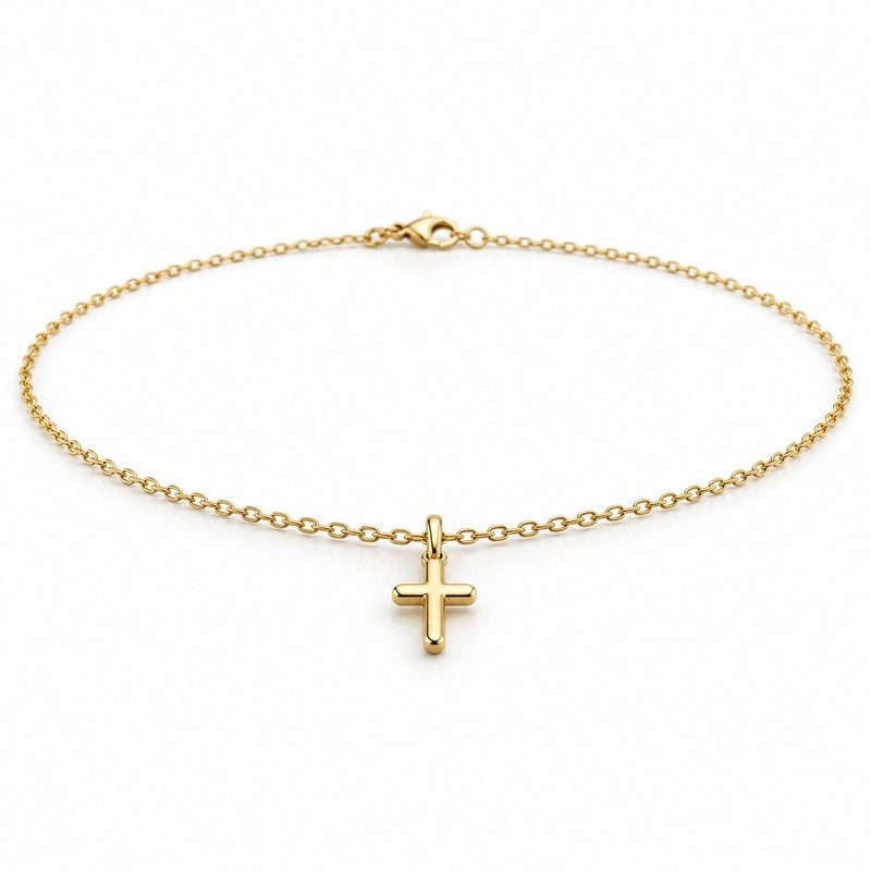 womens gold Stainless Steel petite cross pendant necklace, at a 45-degree angle on white
