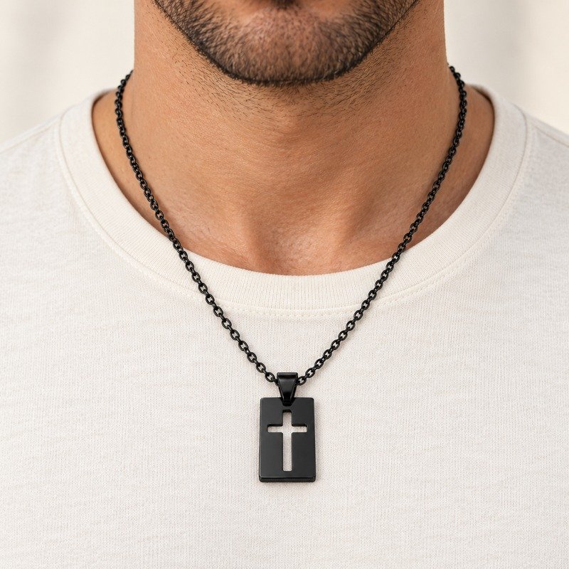 mens black Stainless Steel cutout cross pendant necklace, worn by an adult model