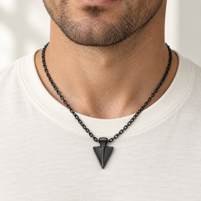 mens black Stainless Steel arrowhead pendant necklace, worn by an adult model