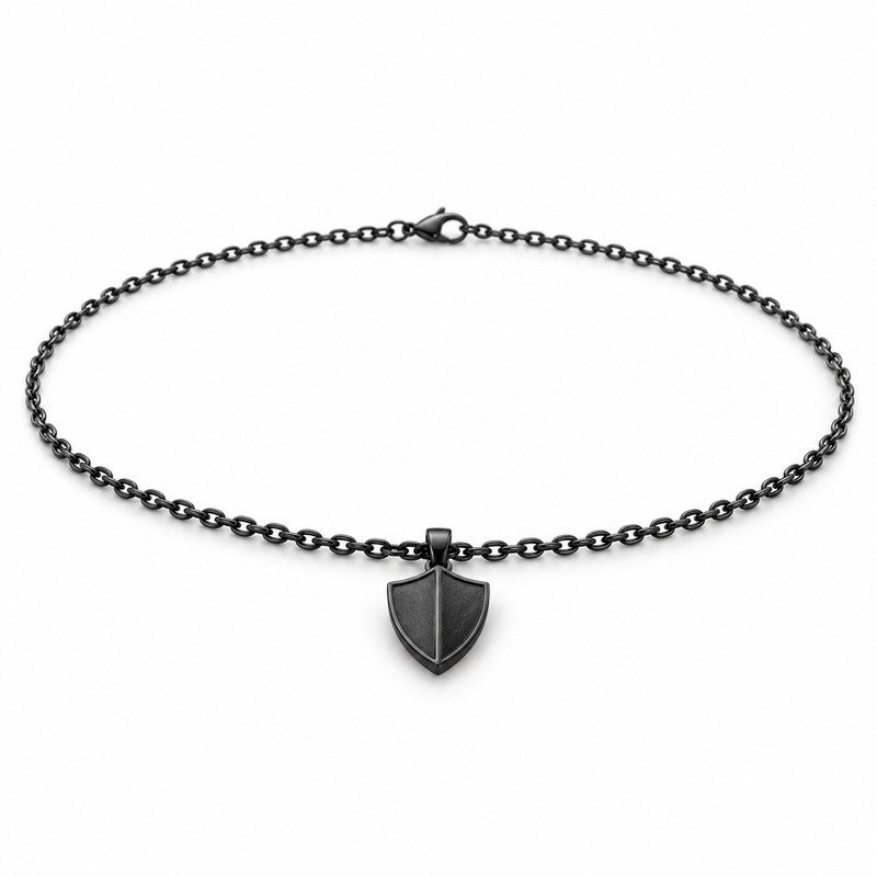 mens black Stainless Steel shield pendant necklace, at a 45-degree angle on white