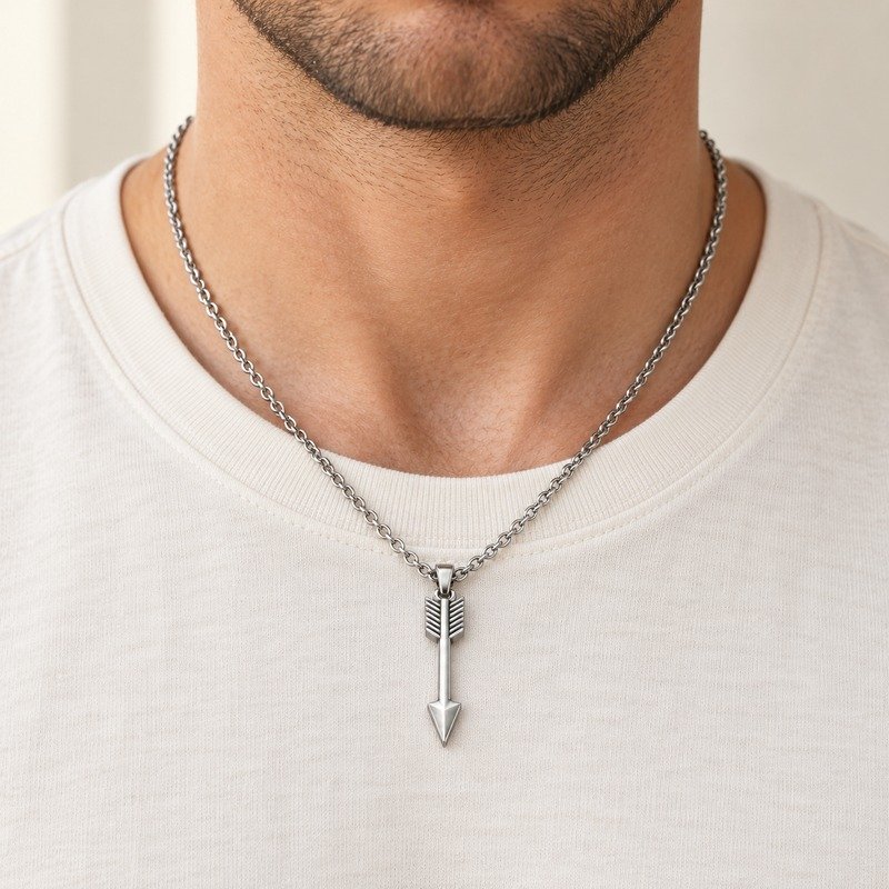 mens silver Stainless Steel arrow pendant necklace, worn by an adult model