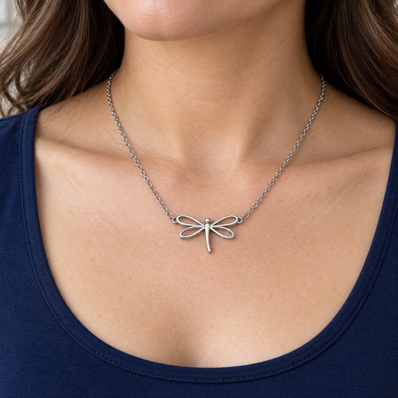 womens silver Stainless Steel dragonfly pendant necklace, worn by an adult model