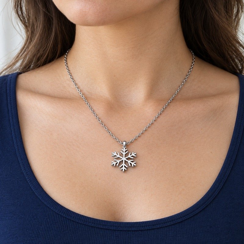 womens silver Stainless Steel snowflake pendant necklace, worn by an adult model