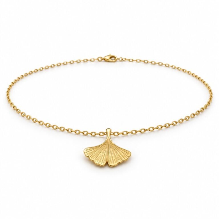 womens gold Stainless Steel ginkgo leaf pendant necklace, at a 45-degree angle on white