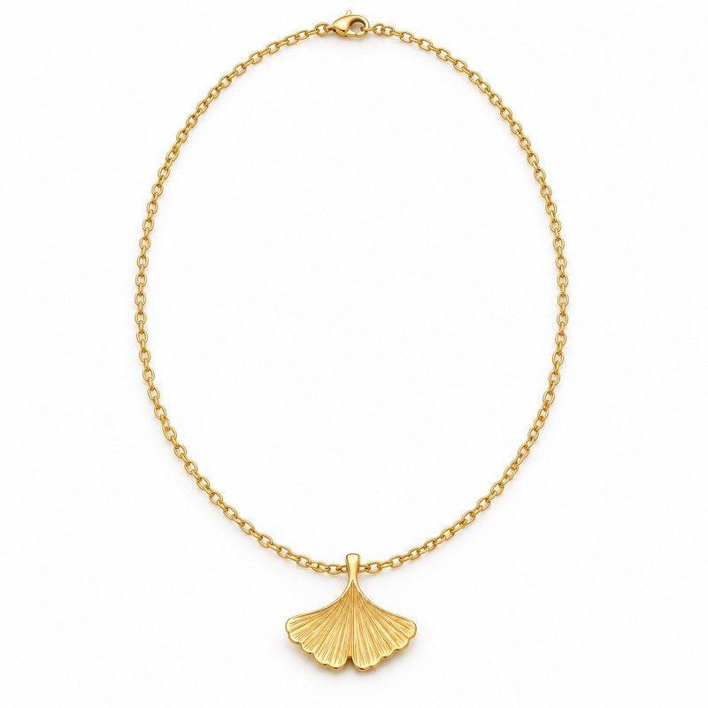 womens gold Stainless Steel ginkgo leaf pendant necklace, front view on white