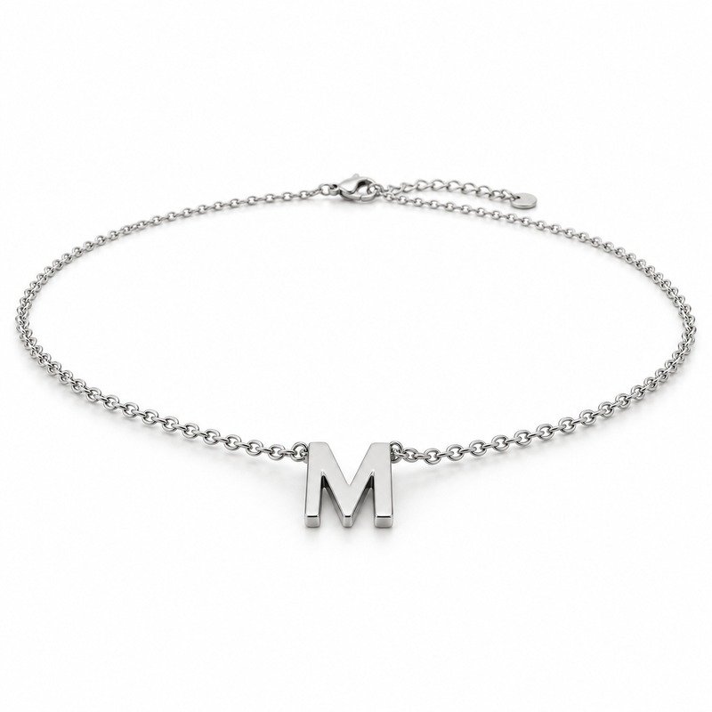 womens silver Stainless Steel initial m necklace, at a 45-degree angle on white