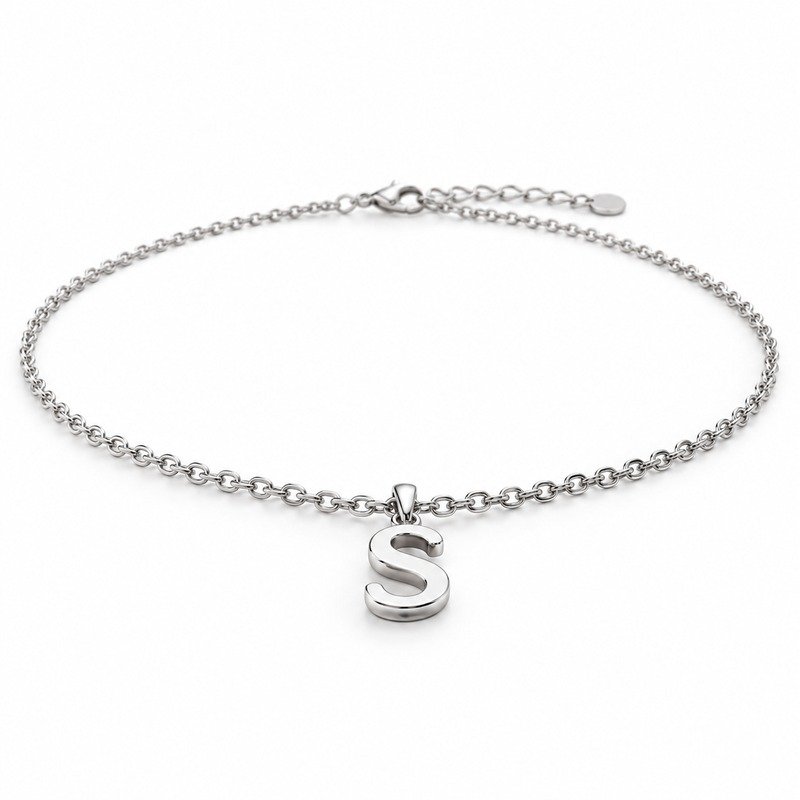 womens silver Stainless Steel initial s necklace, at a 45-degree angle on white