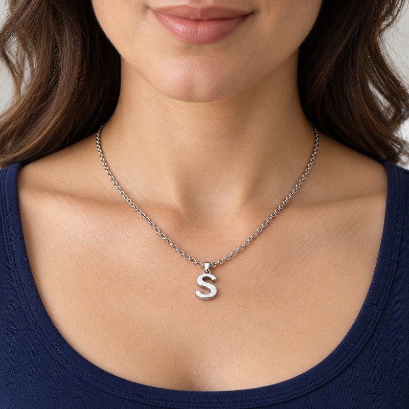 womens silver Stainless Steel initial s necklace, worn by an adult model
