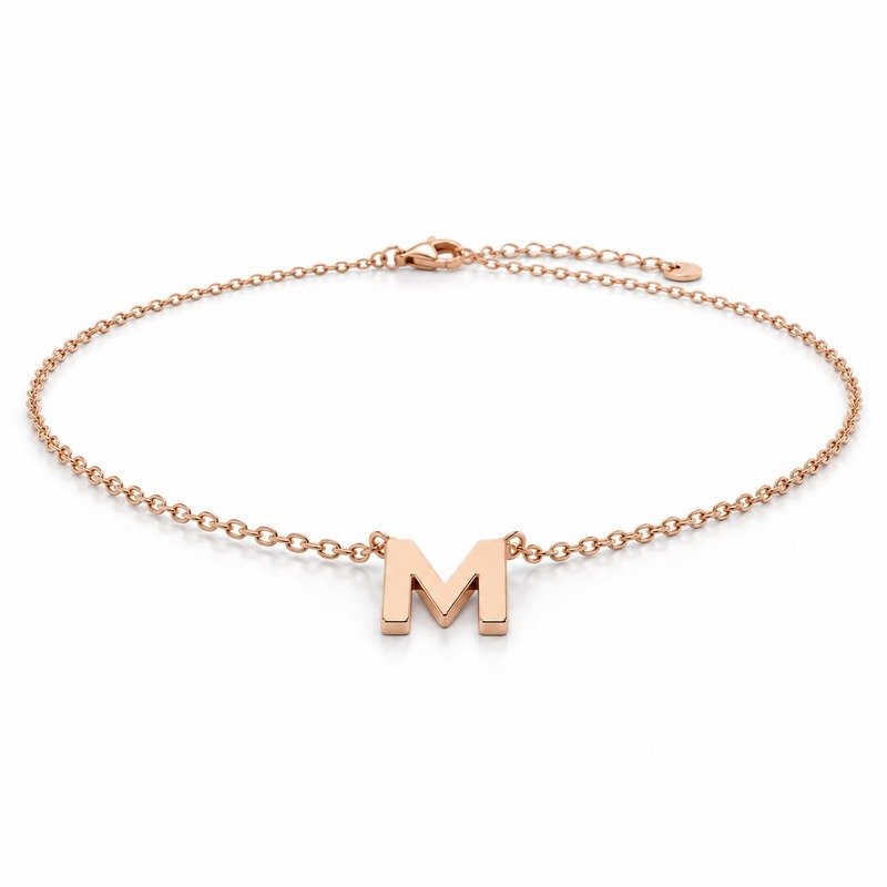 womens rose gold Stainless Steel initial m necklace, at a 45-degree angle on white