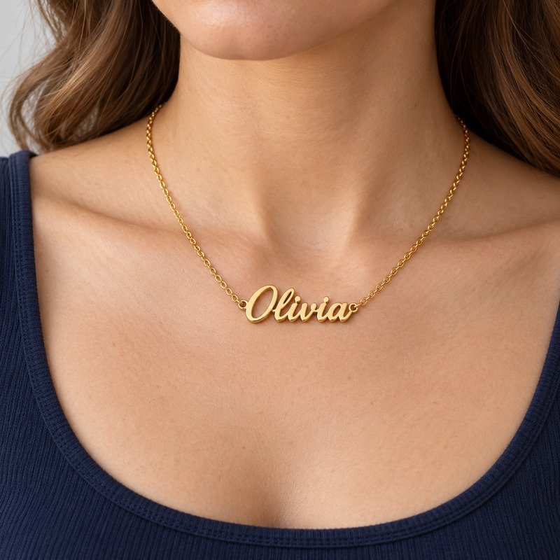 womens gold Stainless Steel olivia name necklace, worn by an adult model