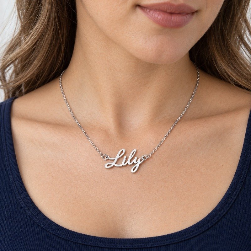 womens silver Stainless Steel lily name necklace, worn by an adult model