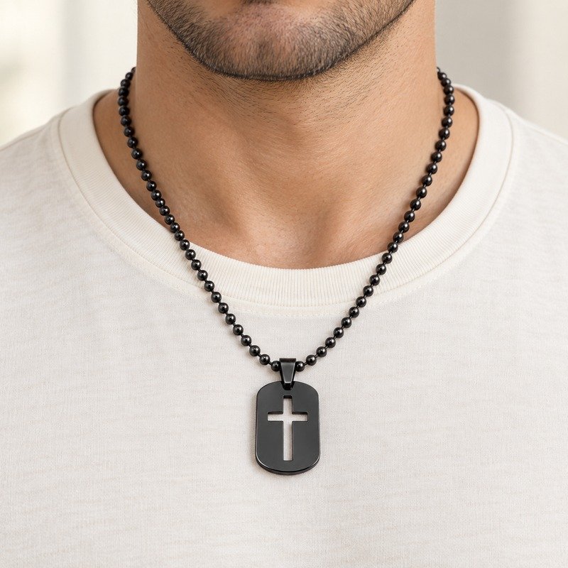 mens black Stainless Steel cross cutout dog tag necklace, worn by an adult model