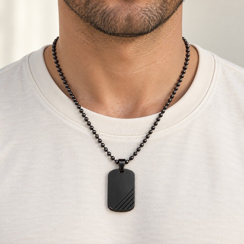 mens black Stainless Steel ridged dog tag necklace, worn by an adult model