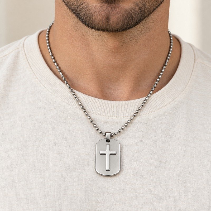 mens silver Stainless Steel cross relief dog tag necklace, worn by an adult model