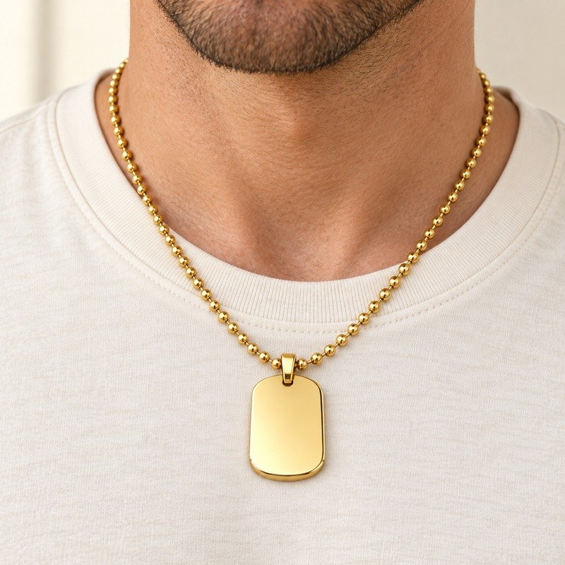 mens gold Stainless Steel oval dog tag necklace, worn by an adult model