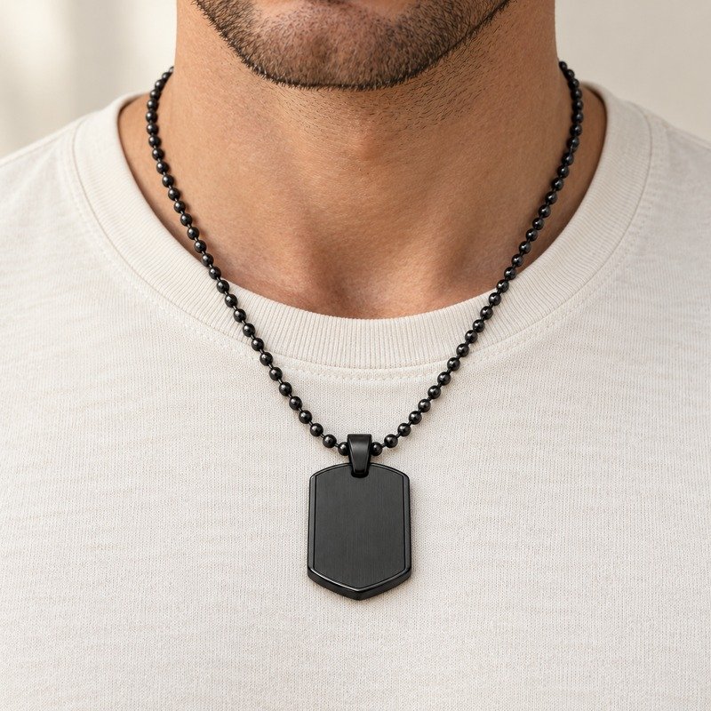 mens black Stainless Steel shield dog tag necklace, worn by an adult model