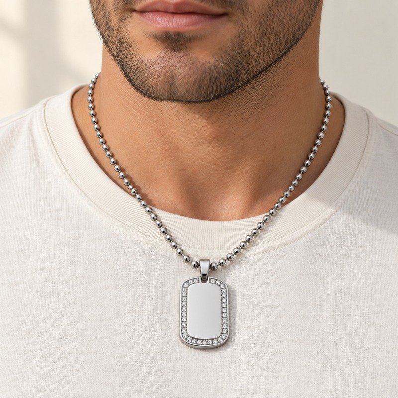 mens silver Stainless Steel crystal border dog tag necklace, worn by an adult model